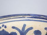 a blue and white bowl sitting on a table