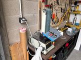 an image of a workbench in a garage with tools on it