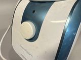 a white and blue machine that is on a table