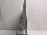 a computer monitor sitting on top of a white table