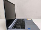 an open laptop computer sitting on top of a white table