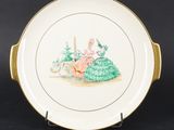 a close up of a plate with a woman sitting on a bench