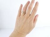 a woman ' s hand with a ring on it ' s finger
