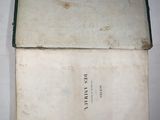 a book with a green border on it sitting on a table
