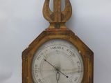 a clock that is sitting on a white surface