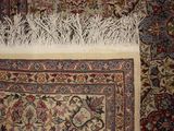 a rug with a bunch of small white plants on top of it