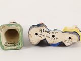 two small ceramic figurines of a horse and a dog
