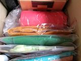 a box filled with many different types of clothes