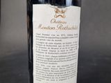 a bottle of wine that is sitting on a table