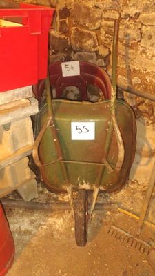 a wheelbarrow with a number on it in a room