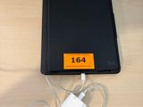 a charger that is plugged into a laptop on a table