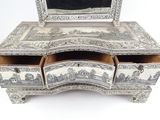 a white and black dresser with a mirror on it