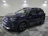 a blue 2020 toyota c - hr suv parked on a checkered floor