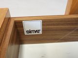 a close up of a piece of wood with a sticker on it