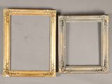 pair of antique gold picture frames on grey background