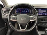 the interior of a car with a steering wheel and dashboard controls