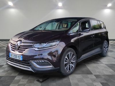 the front view of a dark colored car on a checkered floor