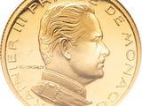 a close up of a gold coin with a portrait of a man