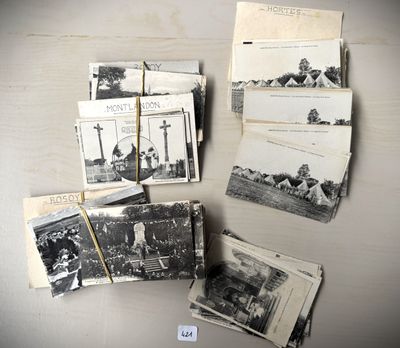 several old black and white photographs of people and buildings on a table