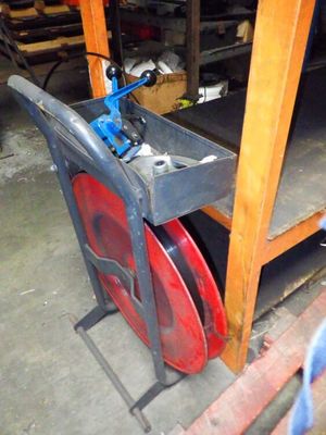 a picture of a red and black chair in a garage