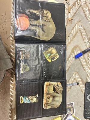 a lot of items that are on the floor next to a cell phone
