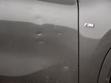 a close up of a car door with a sticker on it