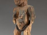 a close up of a statue of a person on a stand
