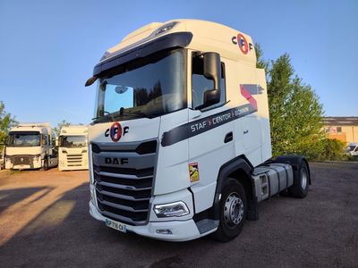 a large white truck parked in a parking lot