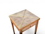 a small wooden table with a marble top on a white background