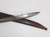 a pair of scissors on a table with a white background