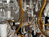 a chandelier that has a lot of glass hanging from it