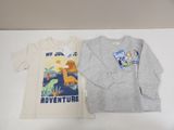two children ' s t - shirts that are on a table