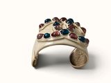 an image of a ring made of silver and colored stones