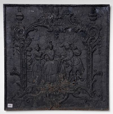 an old black plaque with a picture of a group of people on it