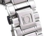 a close up of a watch on a white surface