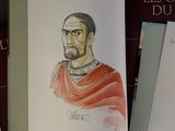 a book with a drawing of a man in a red cloak