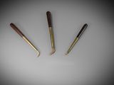 three different types of knitting needles on a white surface