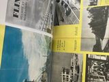 un livre ouvert sur lequel figure l'image d'un homme sur une planche de surf