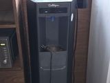 a refrigerator and a microwave in a small room