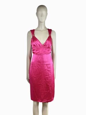 the mannequin is wearing a pink dress with a v - neck