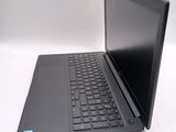 a black laptop computer sitting on a white surface