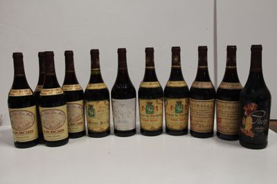 several bottles of wine are lined up in a row on a table