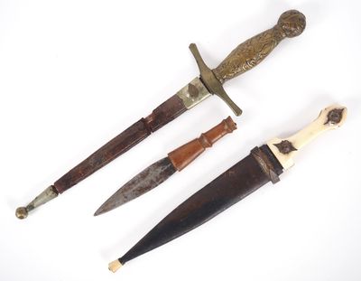 three different types of knifes on a white surface