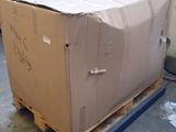 a large cardboard box on a pallet in a warehouse