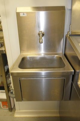 a stainless steel sink and a stainless steel sink in a kitchen