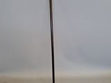 a cane that is sitting on the floor next to a book