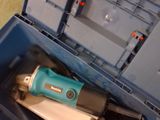 a blue tool box with tools in it on the floor