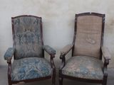 two chairs that are sitting next to each other