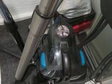 a vacuum that is sitting on the floor in the bathroom