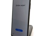the back view of a smartphone with the text dope noi on the screen
